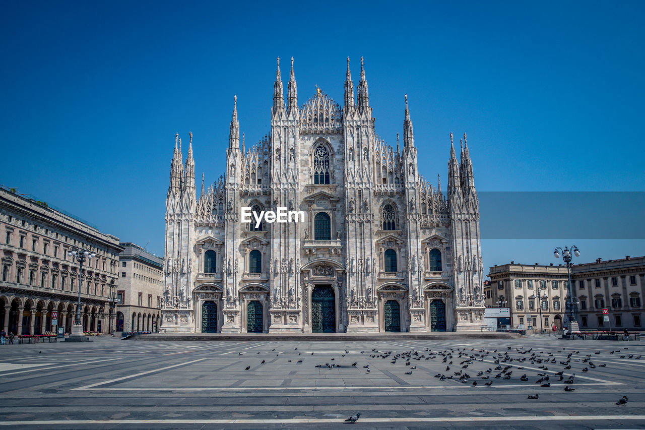 Facade of church against clear blue sky