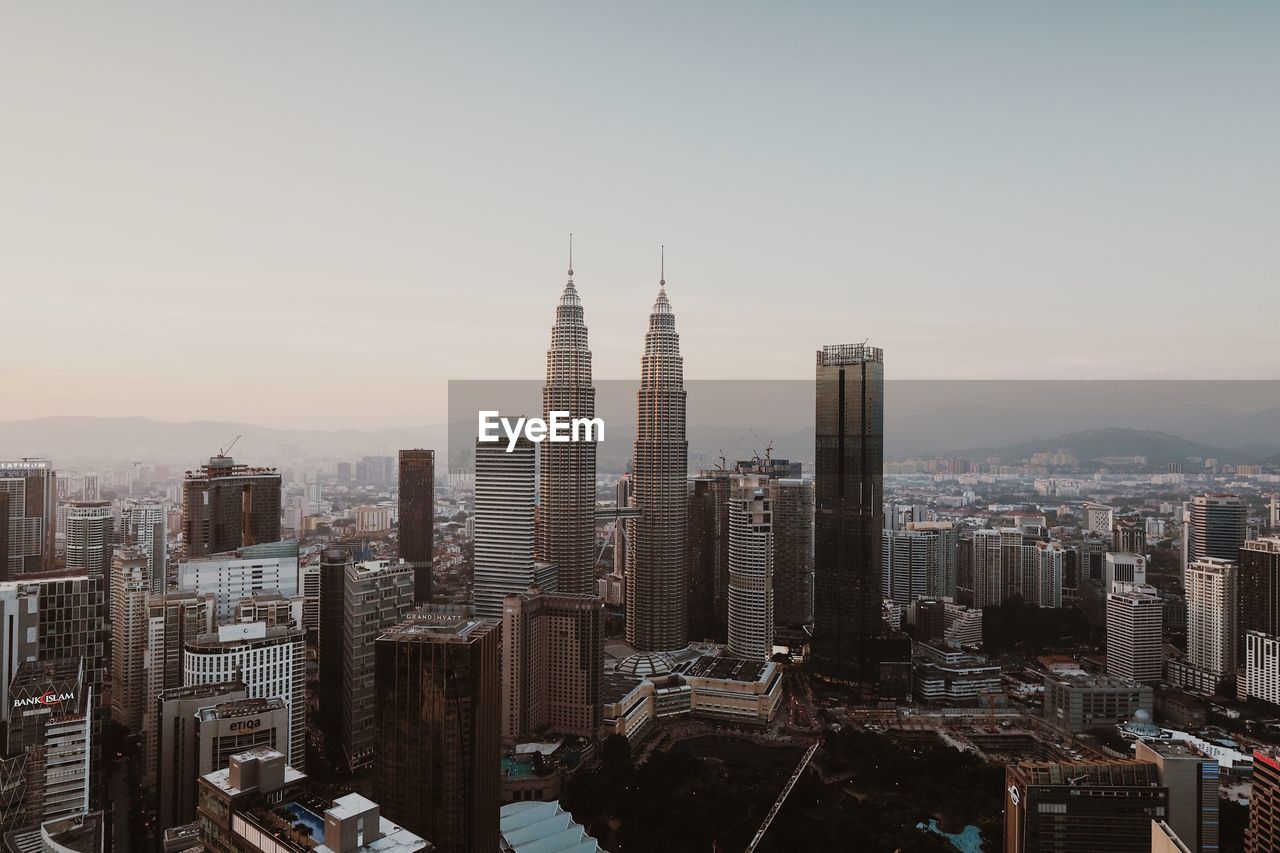 Modern buildings in city against sky