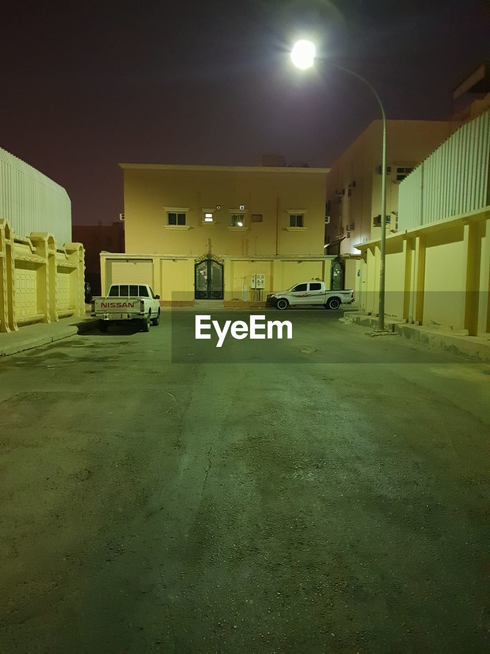 CARS PARKED IN ILLUMINATED BUILDING