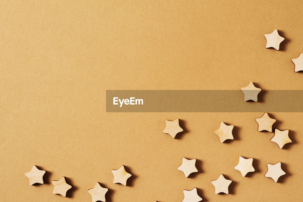 HIGH ANGLE VIEW OF COOKIES ON PAPER