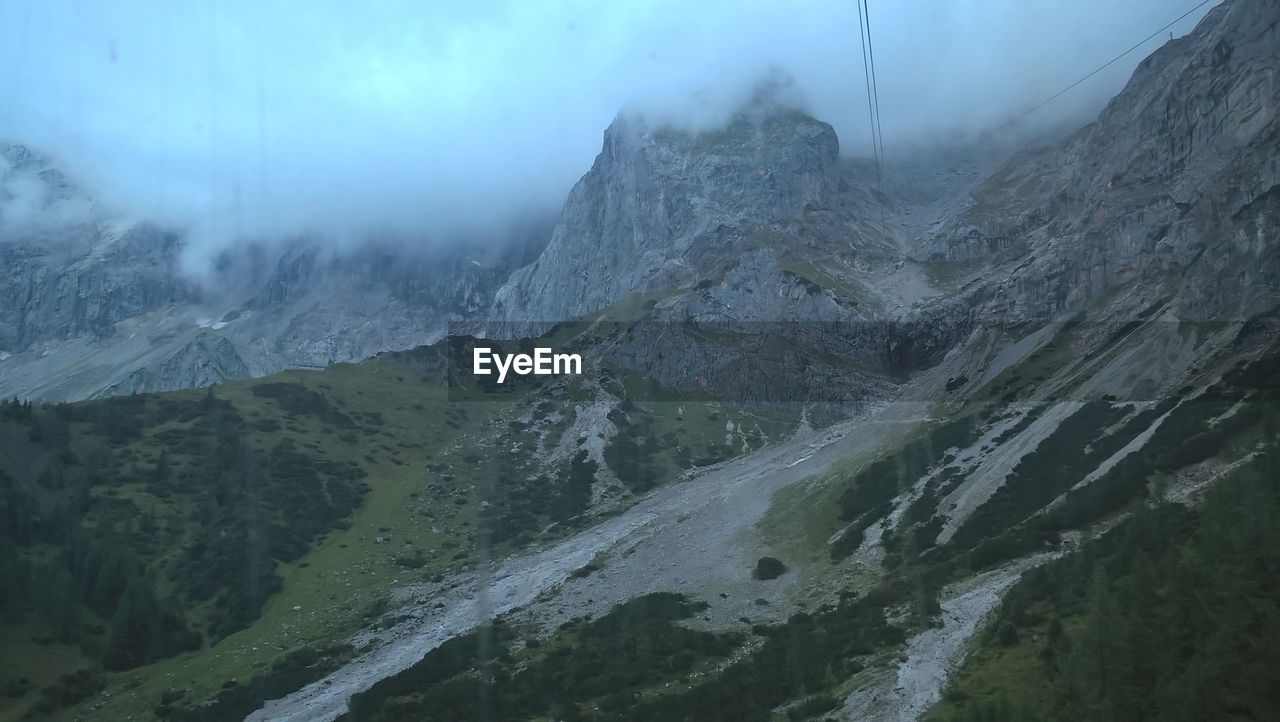 Rocky mountains in foggy weather