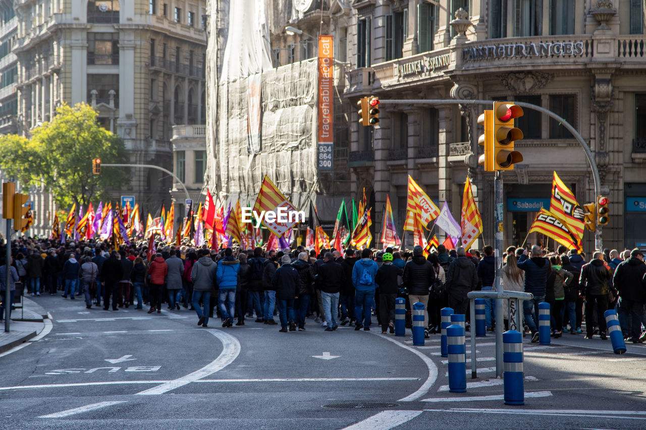 People walking on street in city on manifistation