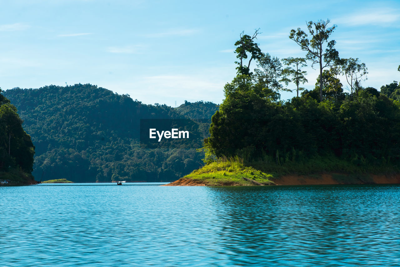 Kenyir lake small islands with beautiful rainforest tropical jungle. scenic landscape view.
