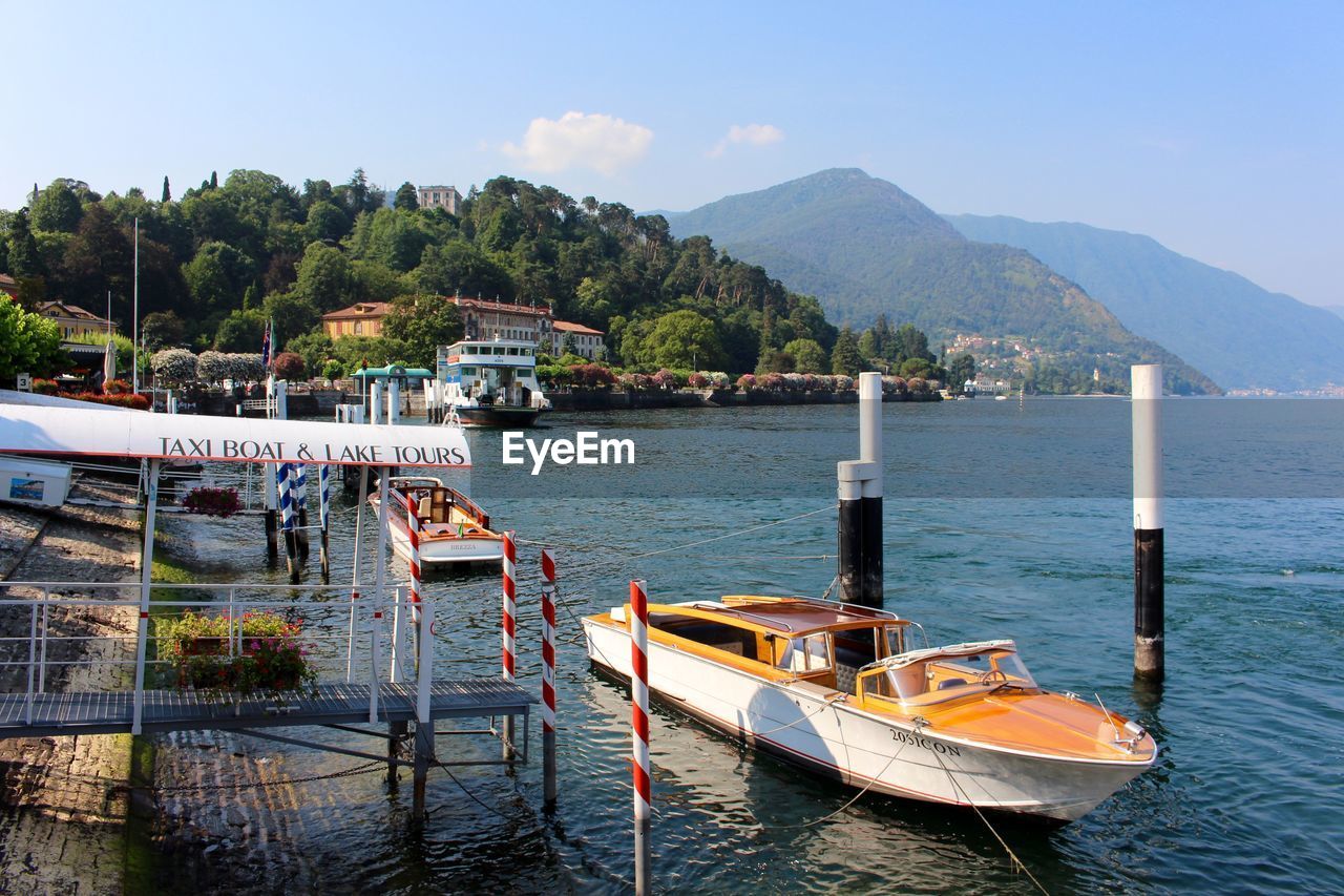 Water taxi anchored by jetty for lake tour