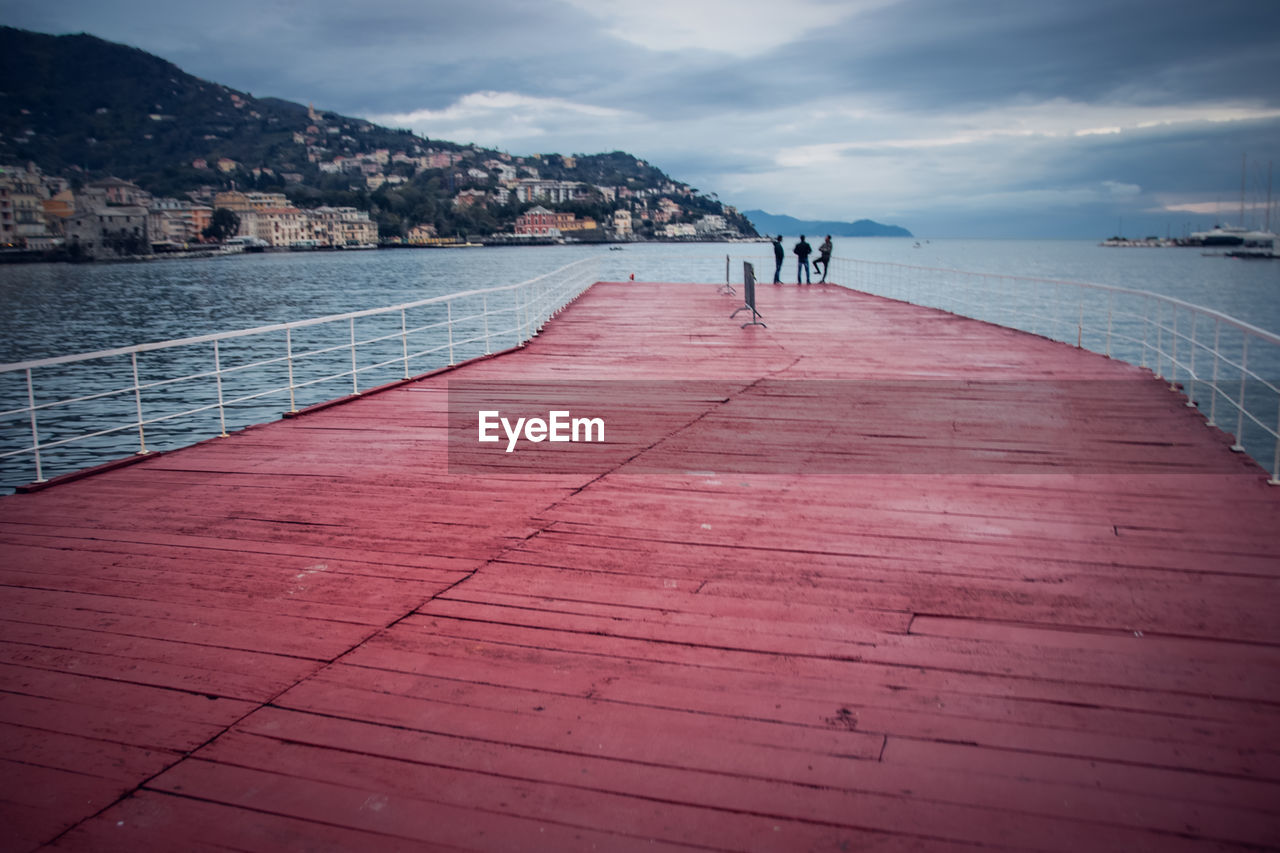 Scenic view of red pontoon against sky