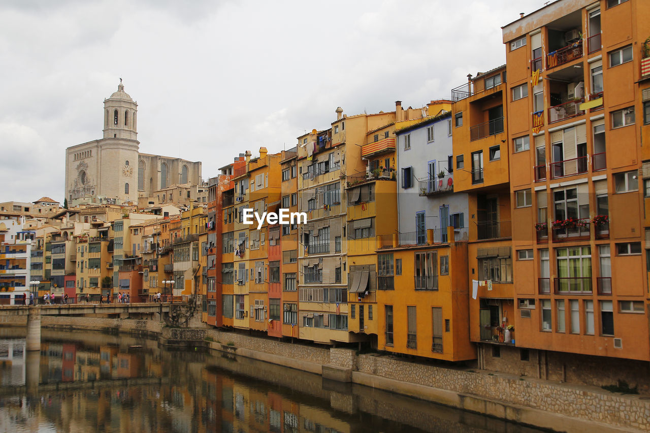 Residential buildings against sky in city