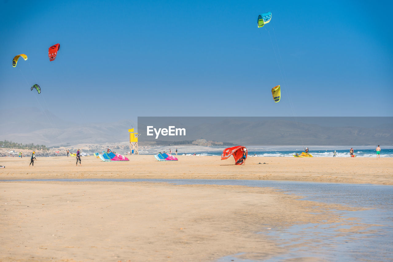 SCENIC VIEW OF PEOPLE ON BEACH