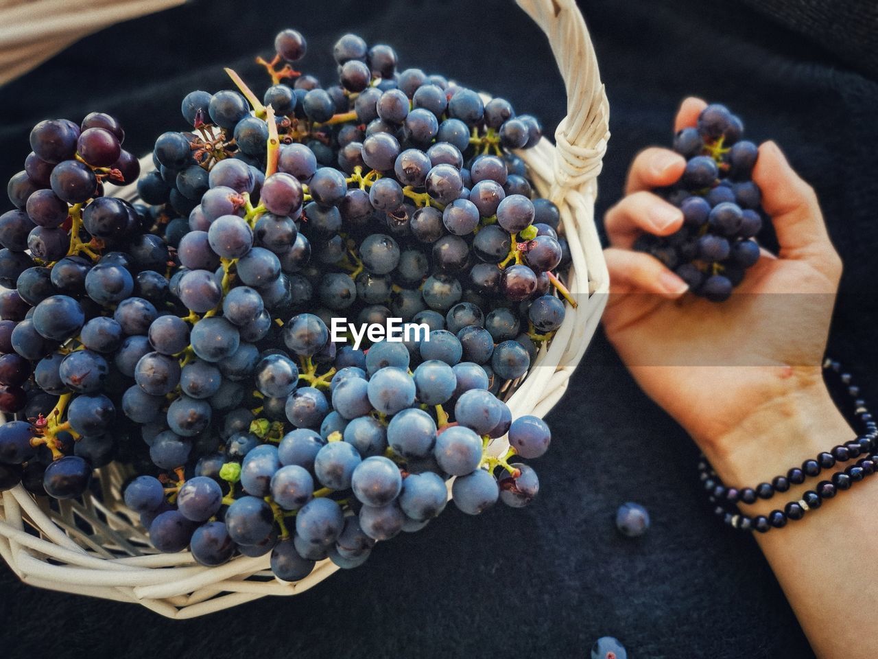High angle view of grapes in basket 