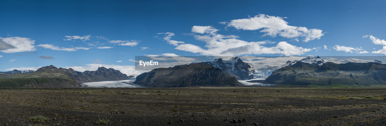 Scenic view of landscape with mountains against sky