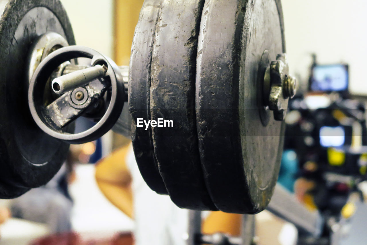Close-up of barbells in gym
