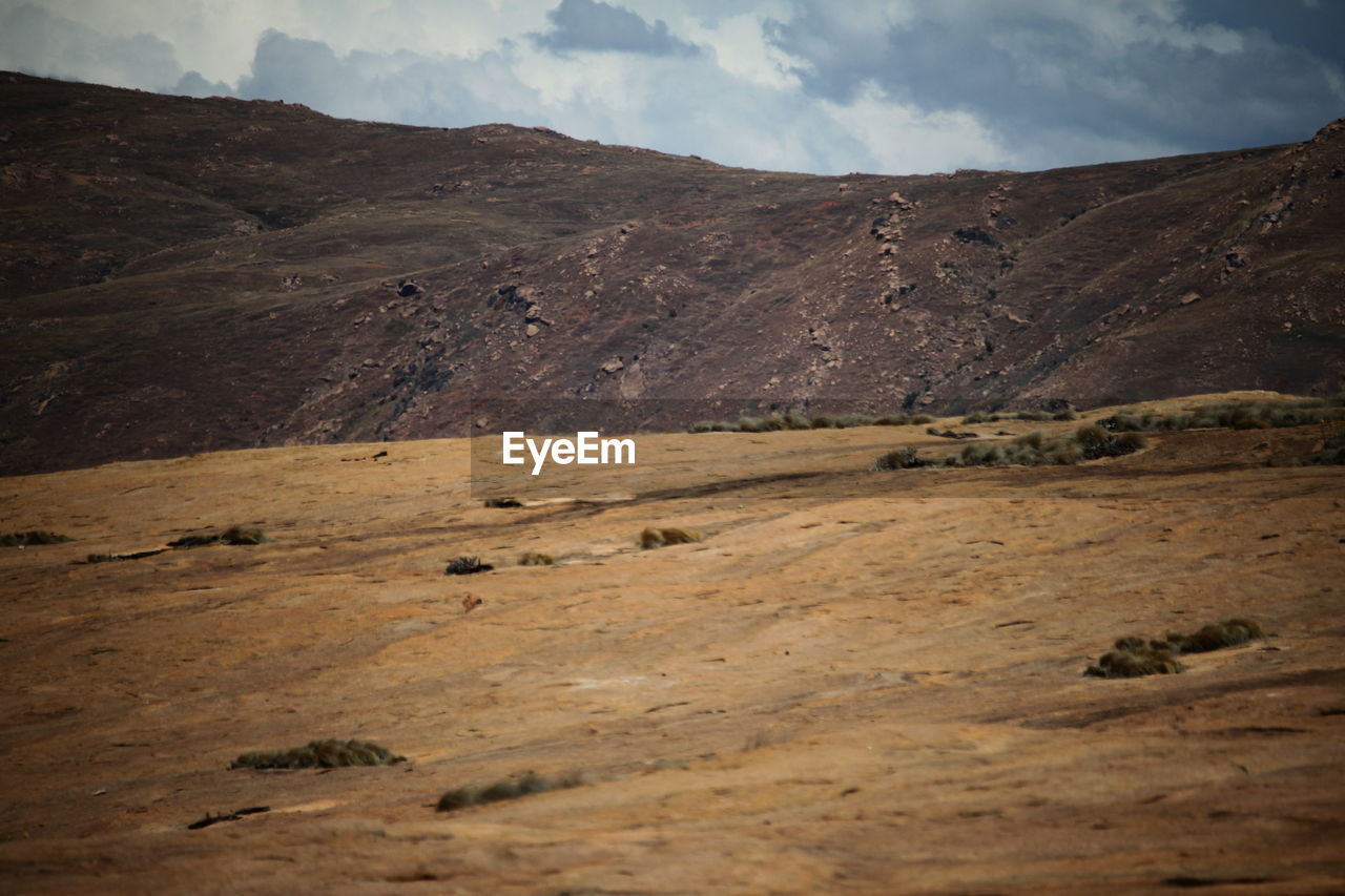 SCENIC VIEW OF BARREN LANDSCAPE AGAINST SKY