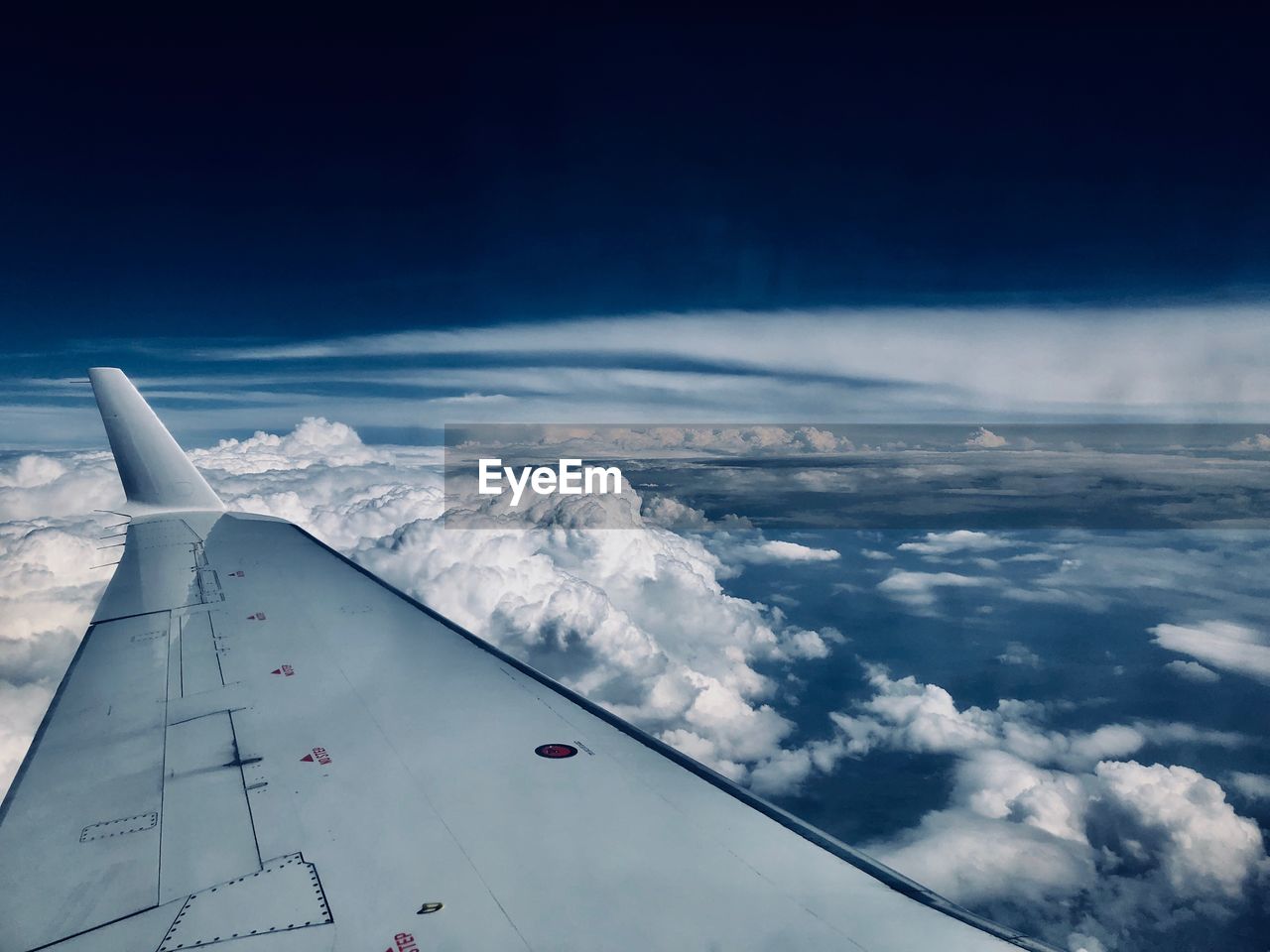 Cropped image of aircraft wing against sky