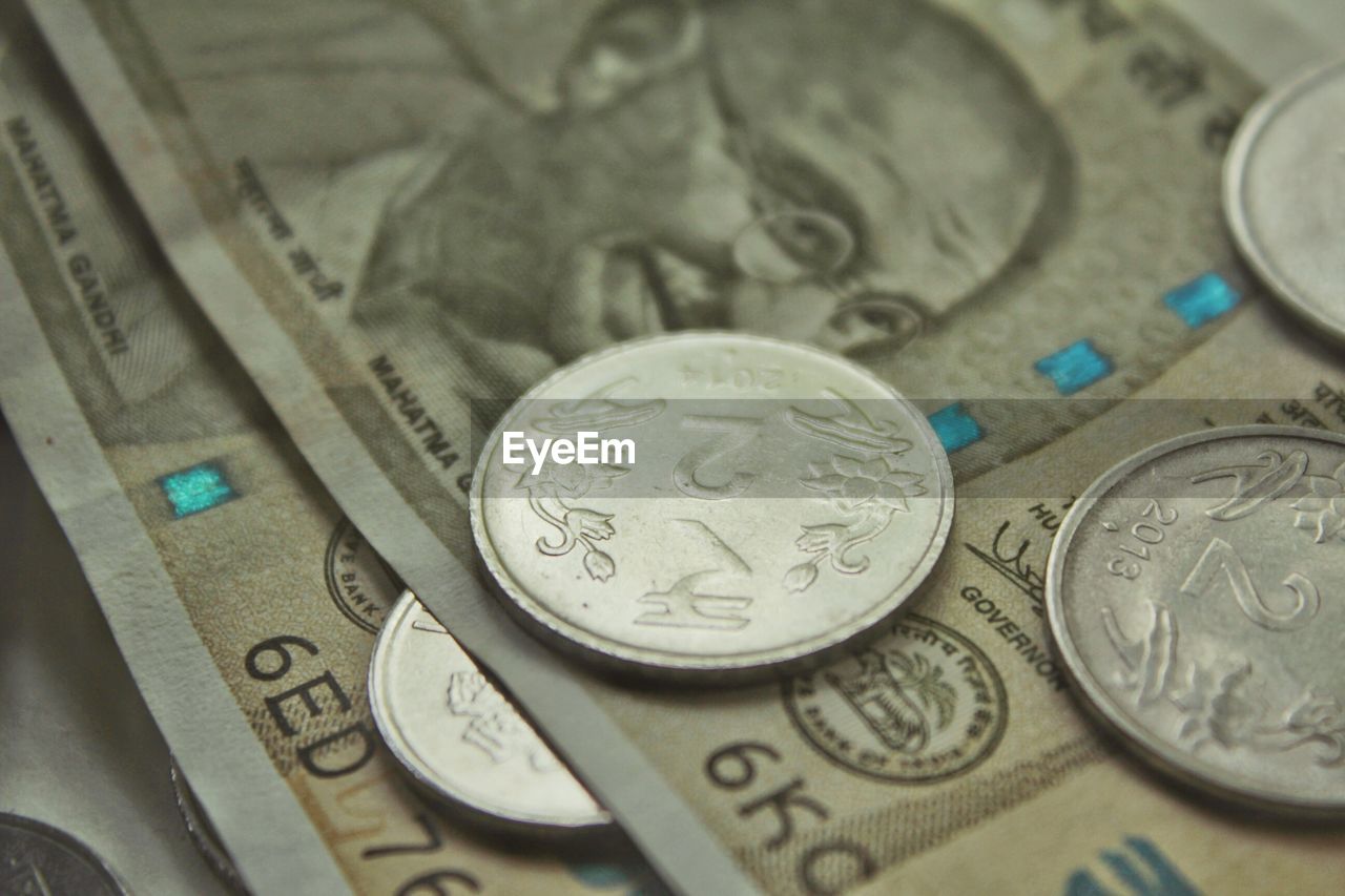 CLOSE-UP OF COINS ON FLOOR