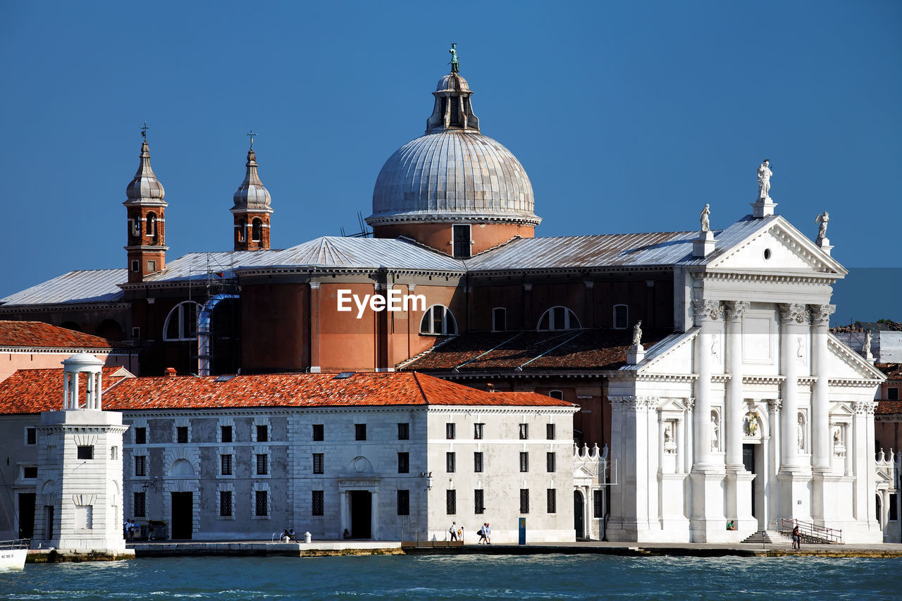 San giorgio maggiore by grand canal against clear blue sky