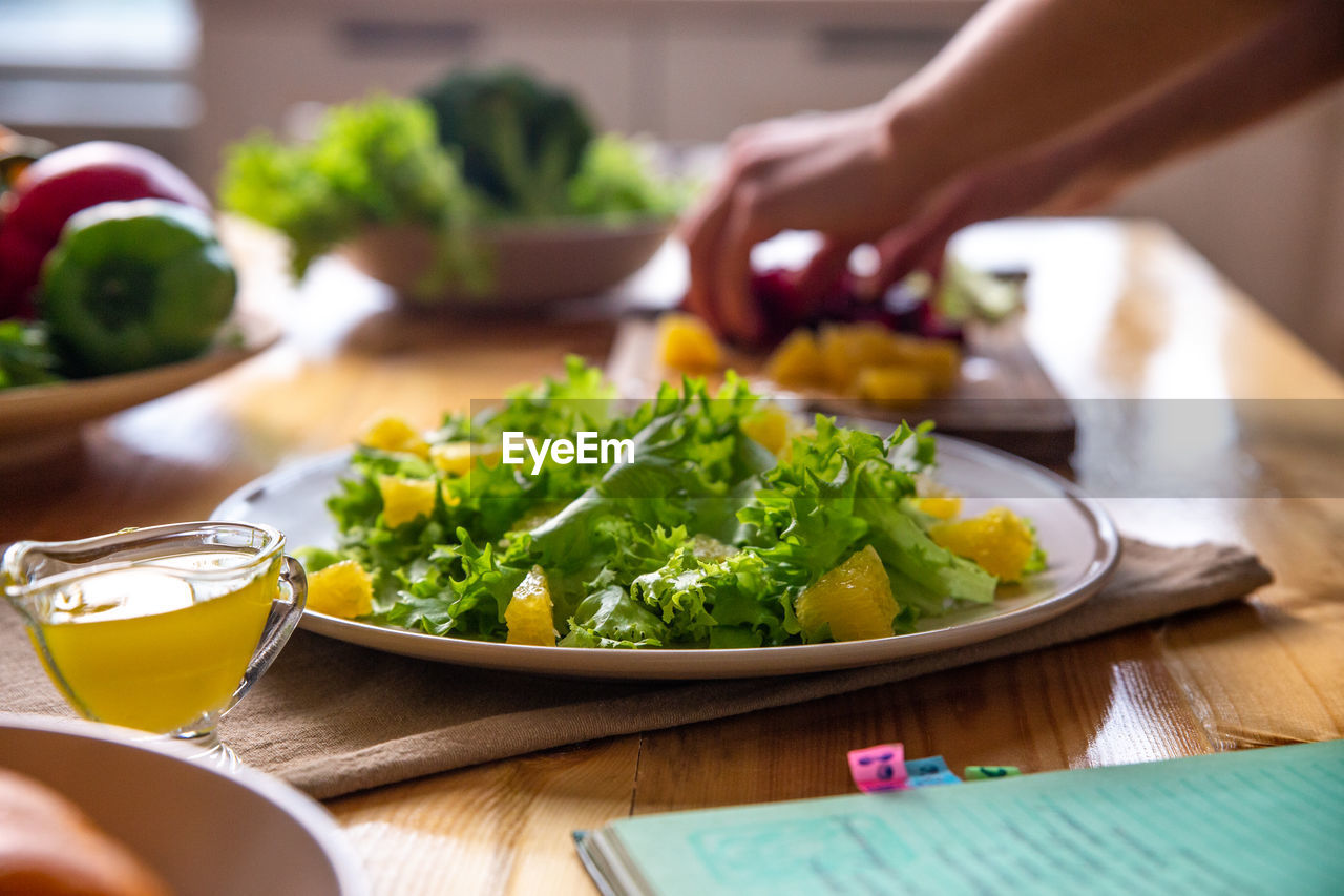 Caesar salad with copyspace on a wooden table on kitchen