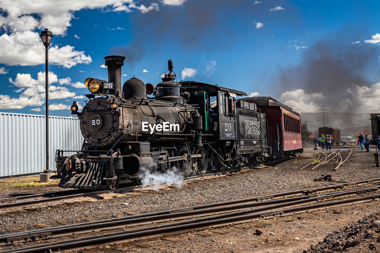 rail transportation, track, railroad track, transportation, train, mode of transportation, sky, locomotive, railway, cloud, vehicle, transport, land vehicle, steam train, smoke, nature, public transportation, steam, steam engine, travel, business, outdoors, day, freight transportation, wheel