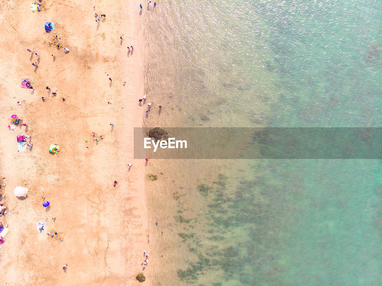 HIGH ANGLE VIEW OF PEOPLE ON BEACH