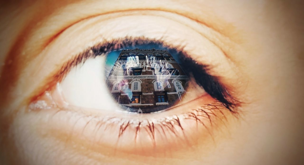 Close-up of human eye with reflection