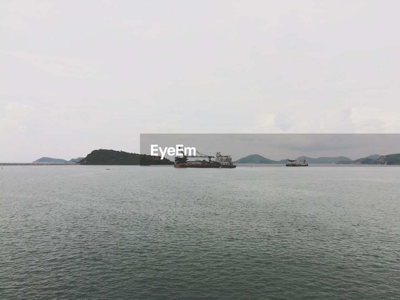 SHIP IN SEA AGAINST SKY