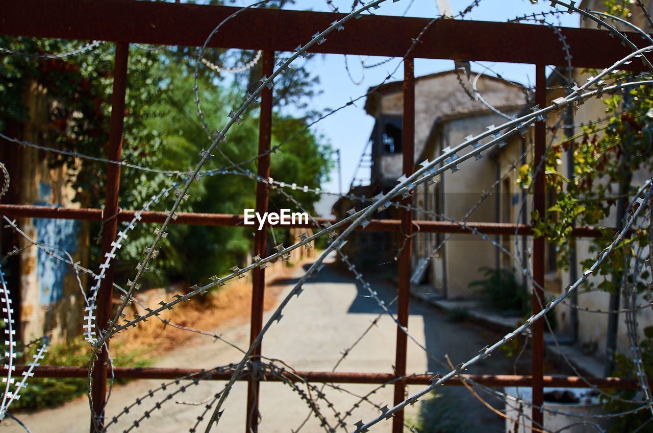 Close-up of fence against building