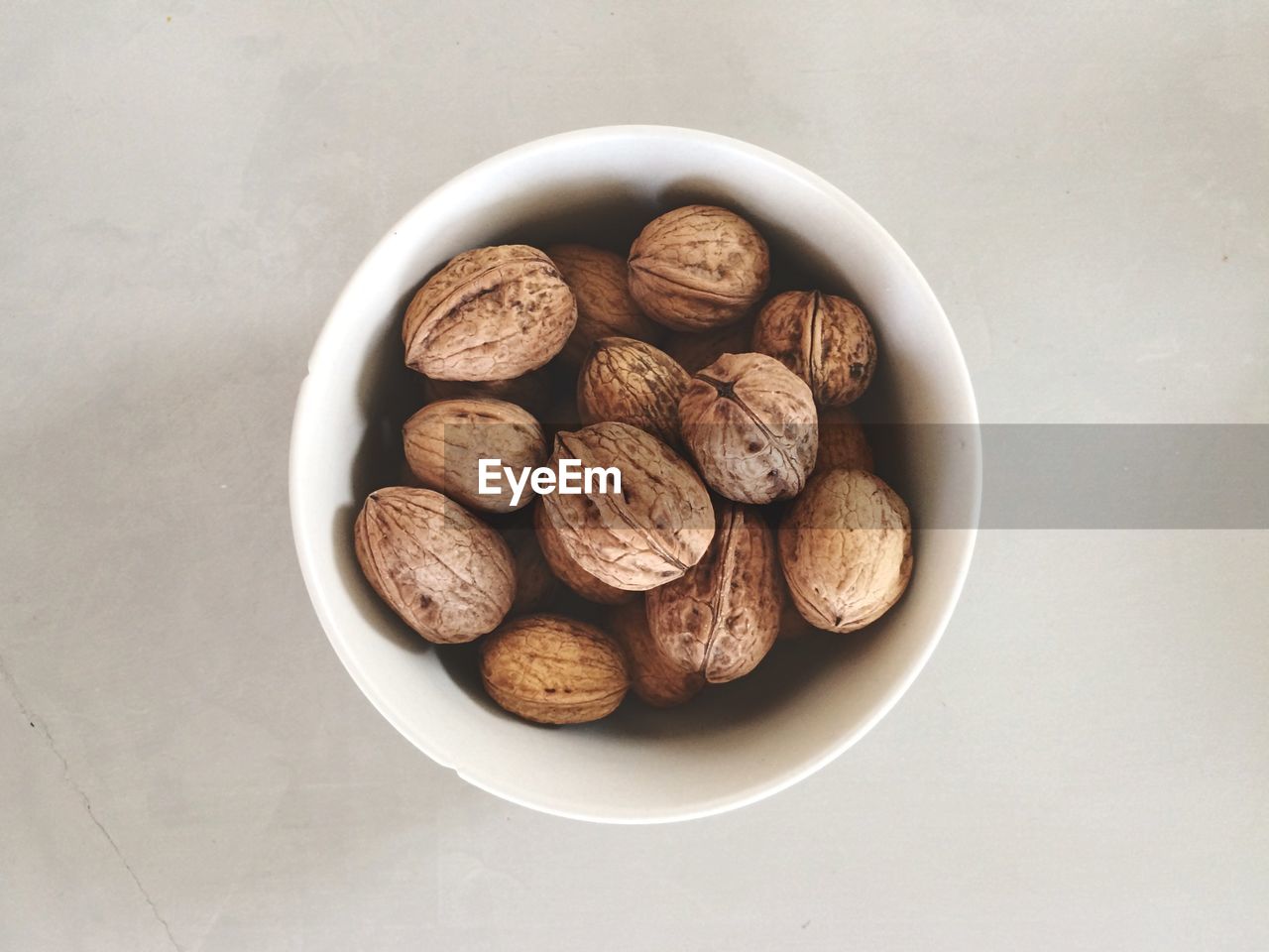 Overhead view of walnuts over white background