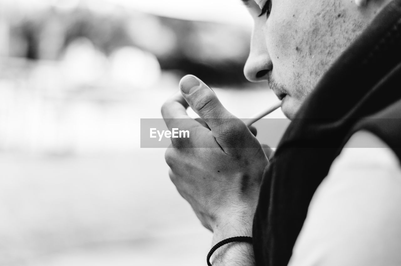 Close-up of man smoking cigarette