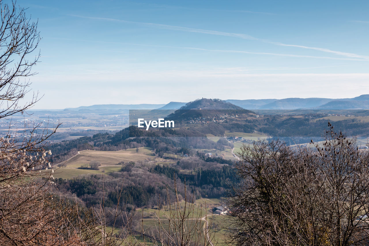 Scenic view of landscape and mountains against sky