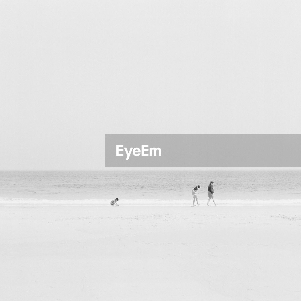 Mother and sons at beach