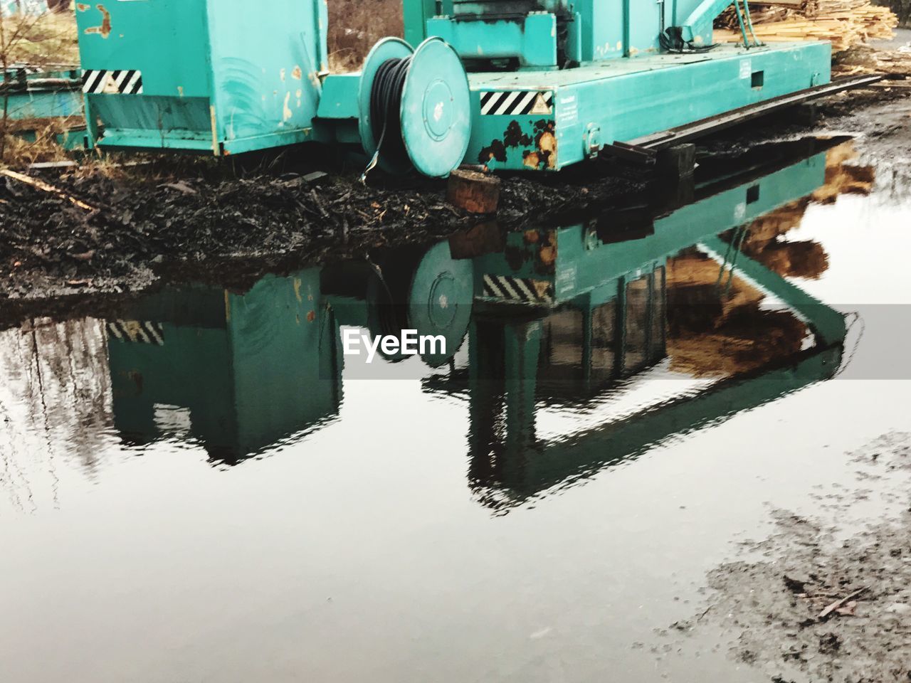 REFLECTION IN PUDDLE ON LAKE