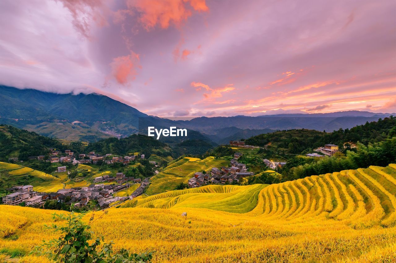 SCENIC VIEW OF LANDSCAPE AGAINST SKY DURING SUNSET