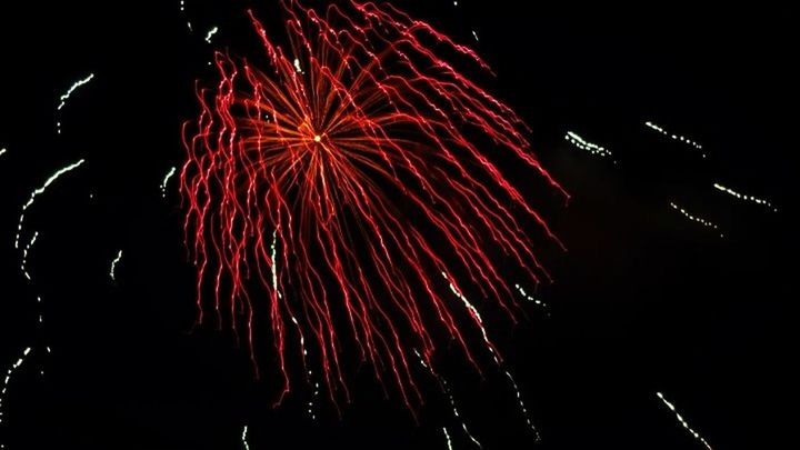 LOW ANGLE VIEW OF FIREWORKS DISPLAY