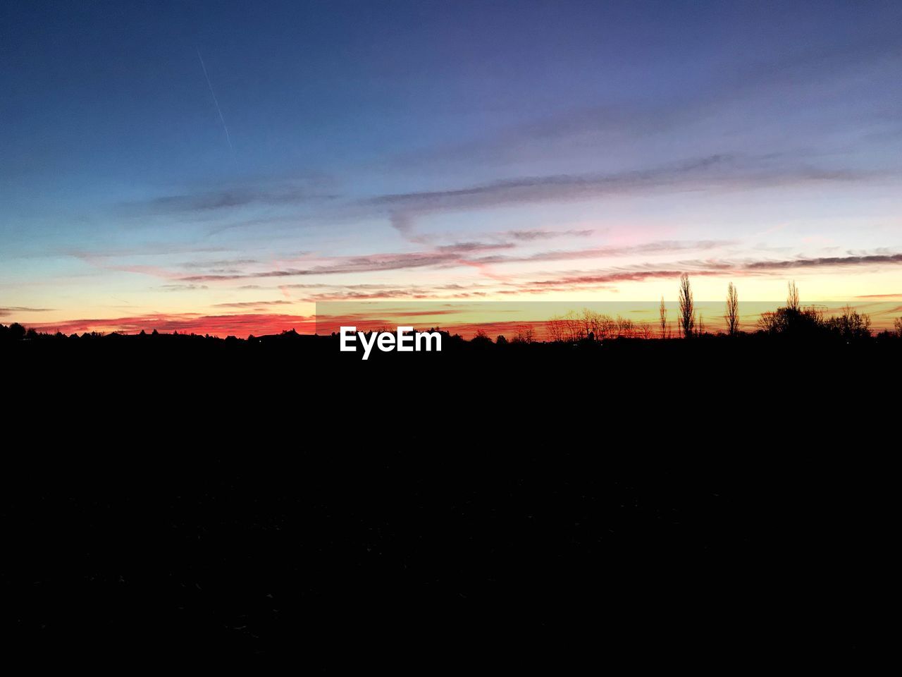 SCENIC VIEW OF SILHOUETTE LANDSCAPE AGAINST SKY DURING SUNSET