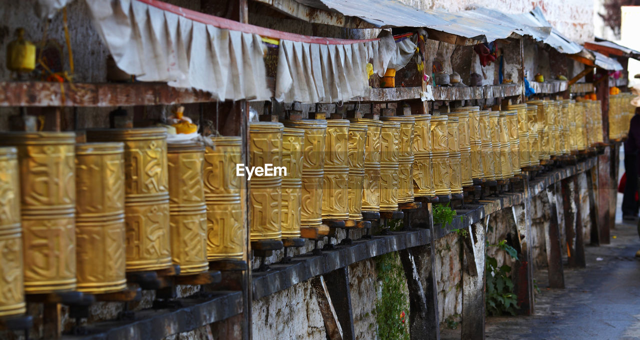 Prayer wheels around the potala palace in lhasa / tibet