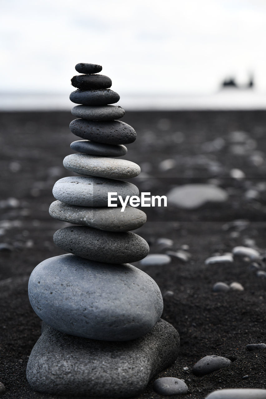 CLOSE-UP OF STONE STACK ON ROCK