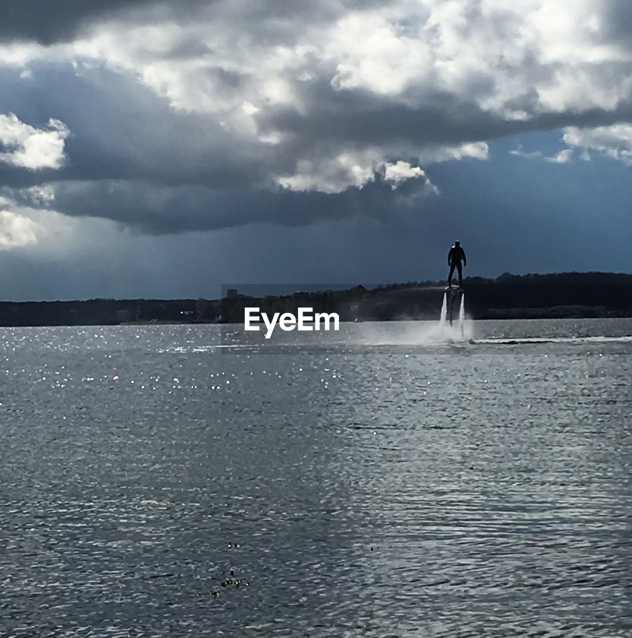 VIEW OF SEA AGAINST CLOUDY SKY