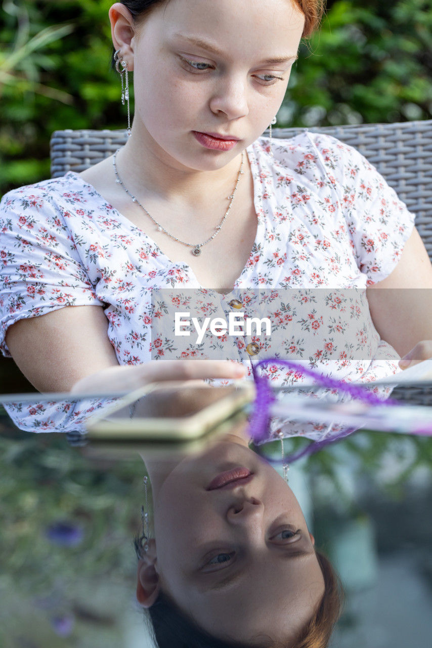 portrait of young woman holding book