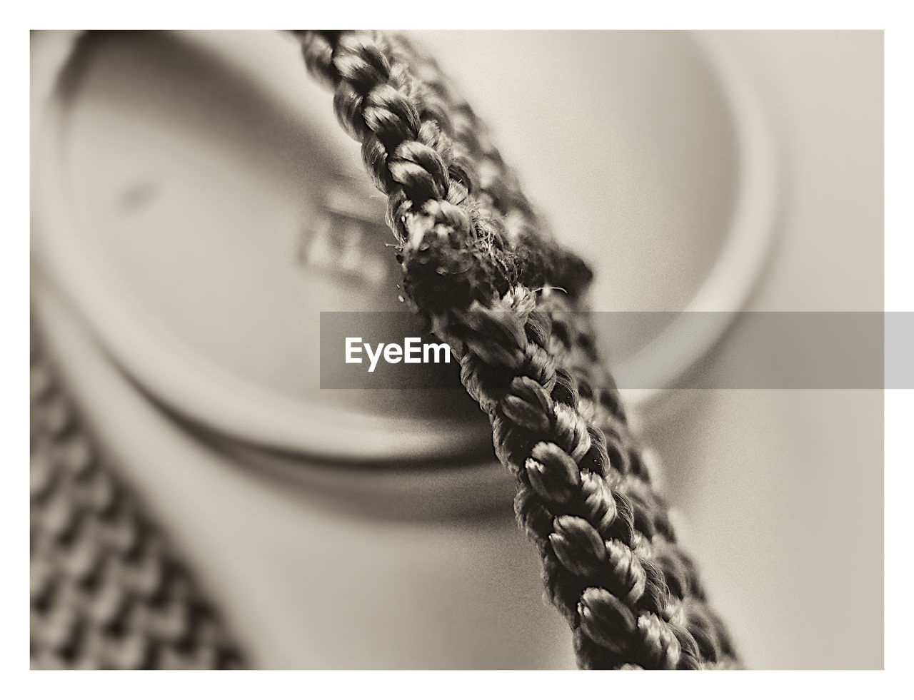 Close-up of bracelet over ring