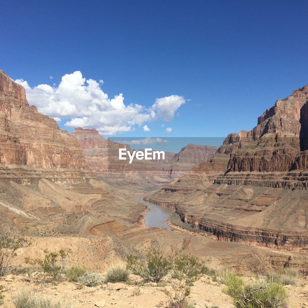 View of rock formations against blue sky