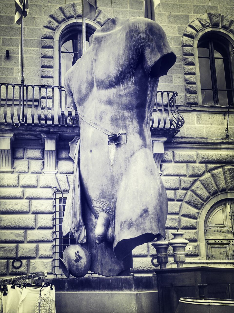 Low angle view of damaged statue against building