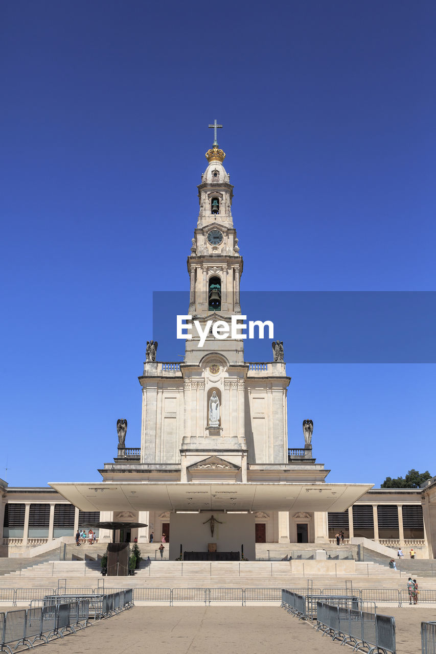 low angle view of historic building against clear blue sky