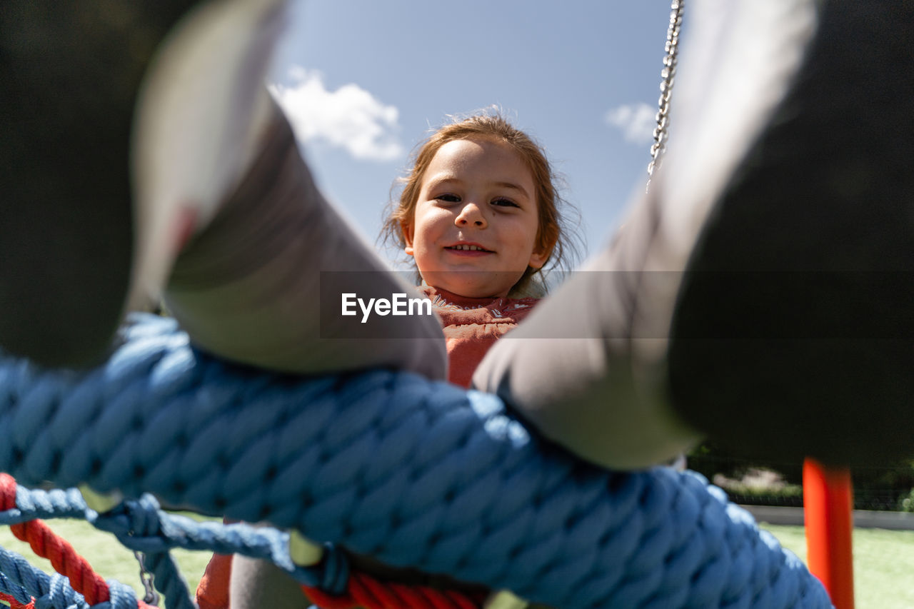 low angle view of woman sitting on boat