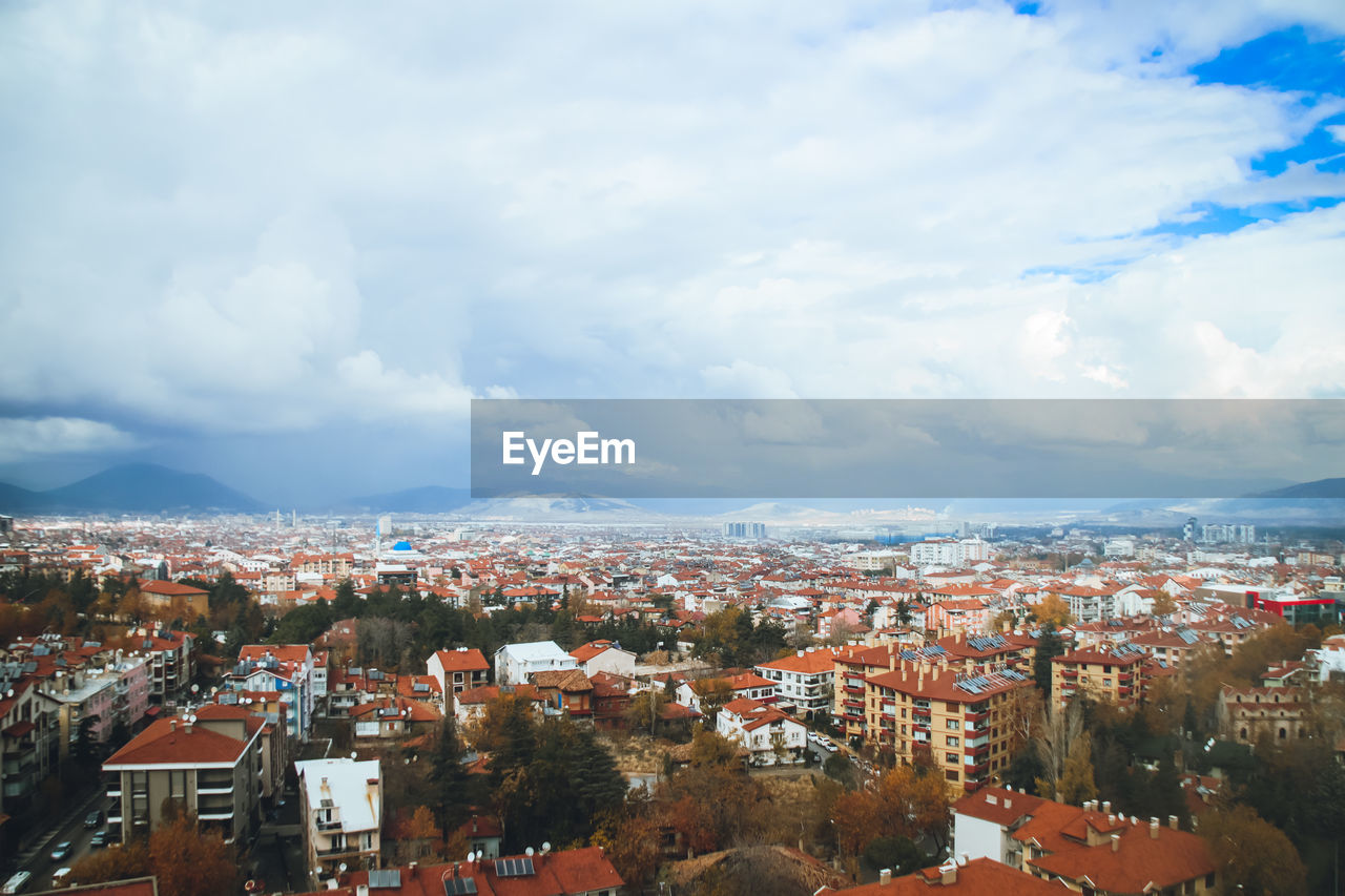 aerial view of townscape against sky