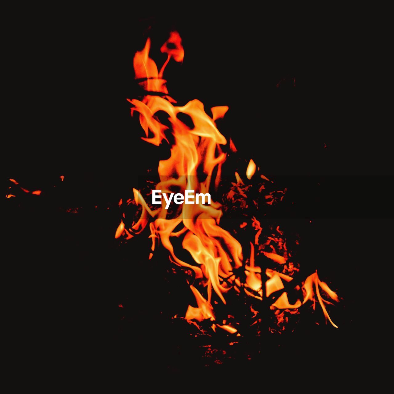 CLOSE-UP OF BONFIRE ON BLACK BACKGROUND