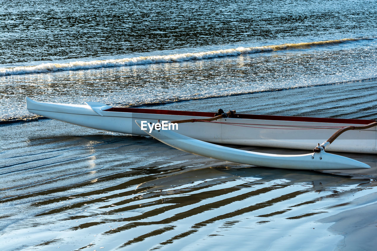 High angle view of boats moored at beach