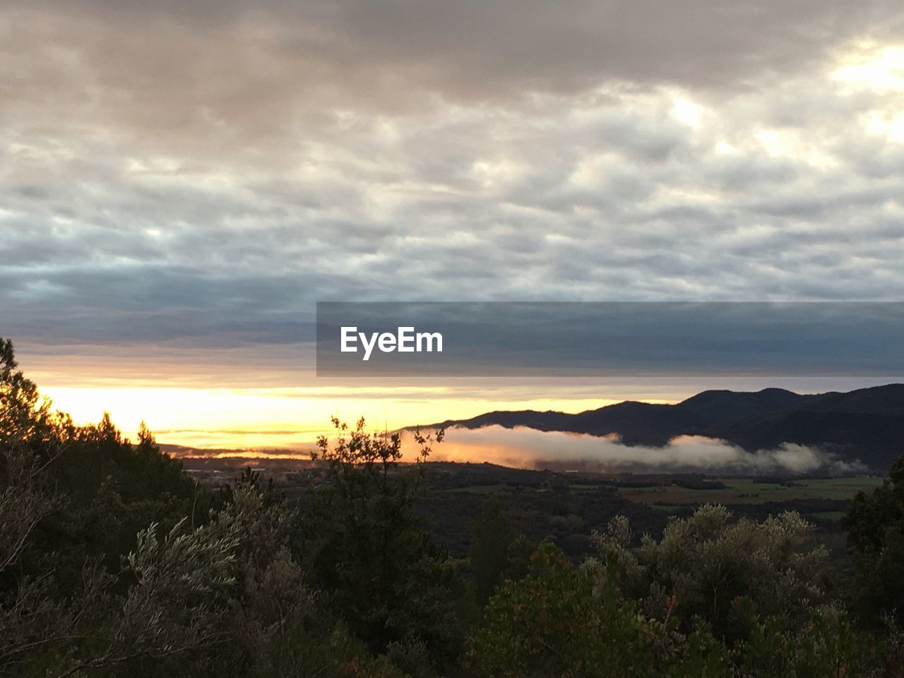 SCENIC VIEW OF DRAMATIC SKY DURING SUNSET