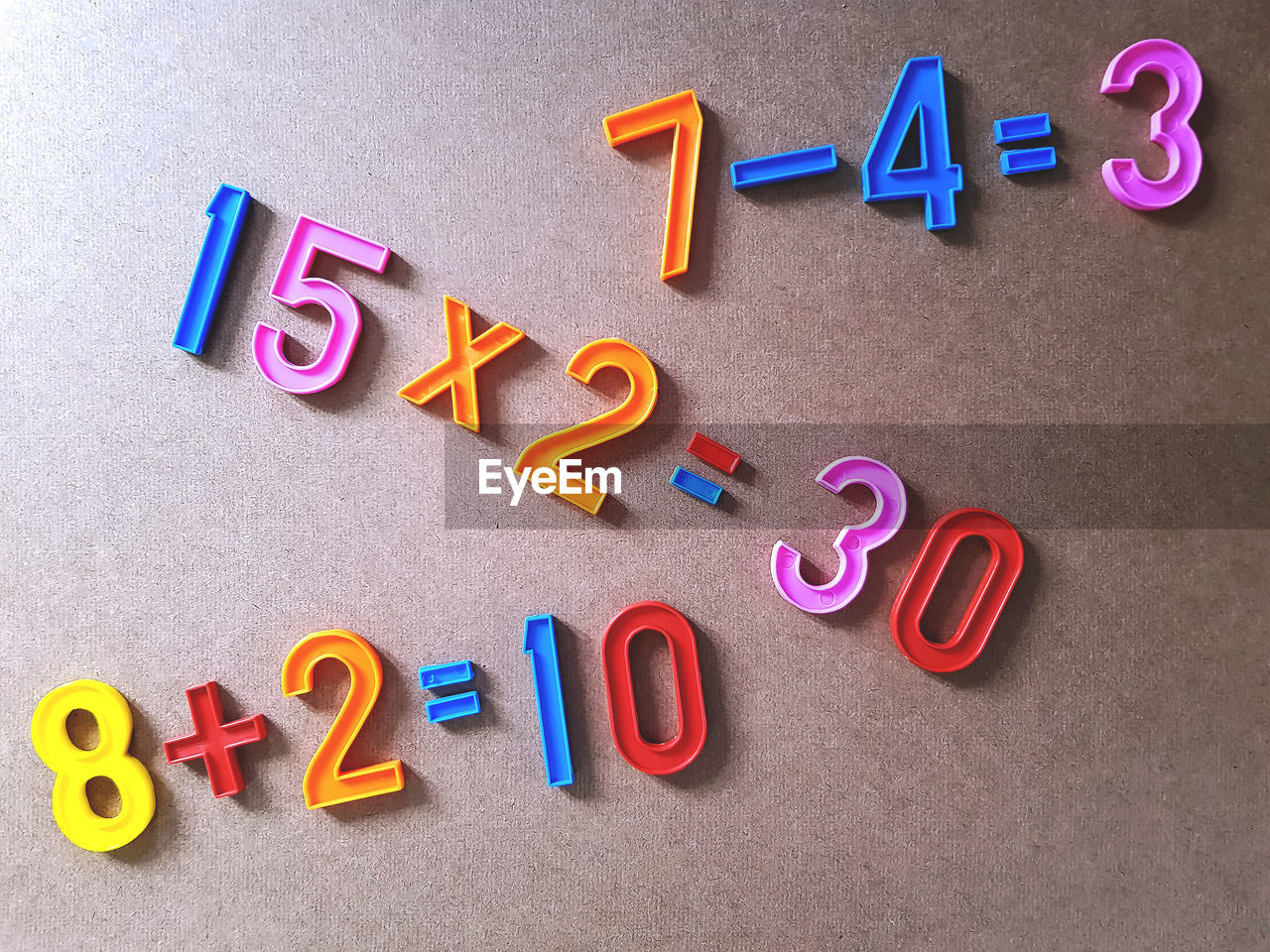 Directly above shot of colorful plastic numbers on table