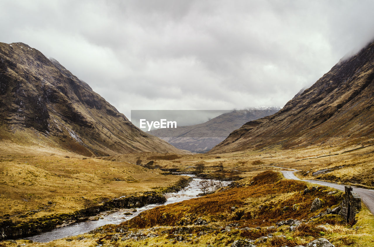 Scenic view of glen etive against sky