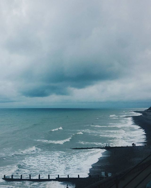 VIEW OF SEA AGAINST CLOUDY SKY