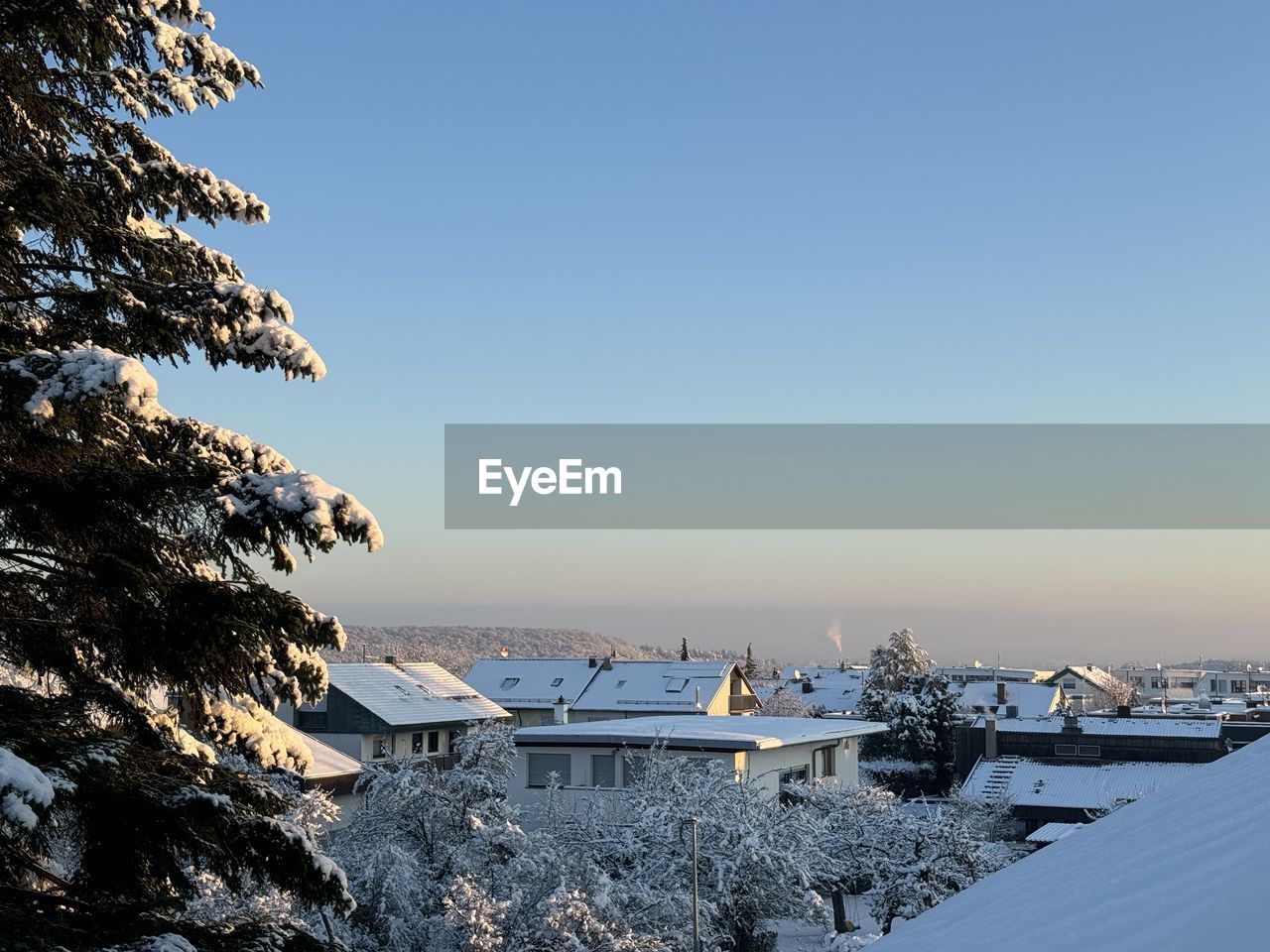 winter, sky, snow, water, nature, scenics - nature, cold temperature, beauty in nature, sea, tree, tranquility, clear sky, architecture, no people, blue, mountain, environment, land, plant, tranquil scene, travel destinations, landscape, built structure, day, travel, outdoors, copy space, reflection, ice, frozen, building, morning, non-urban scene, sunlight, building exterior, beach, tourism, idyllic, shore