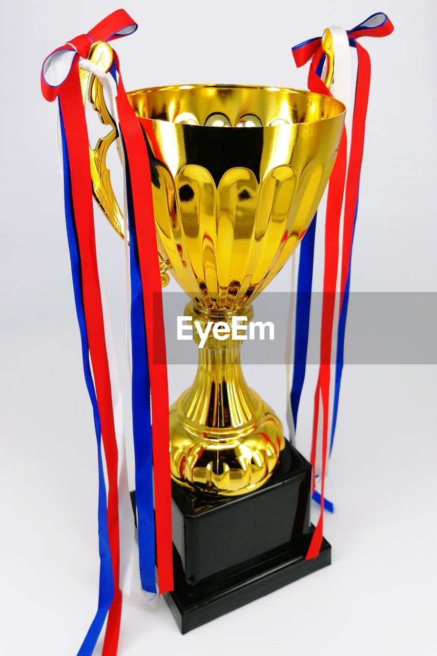 Close-up of trophy against white background